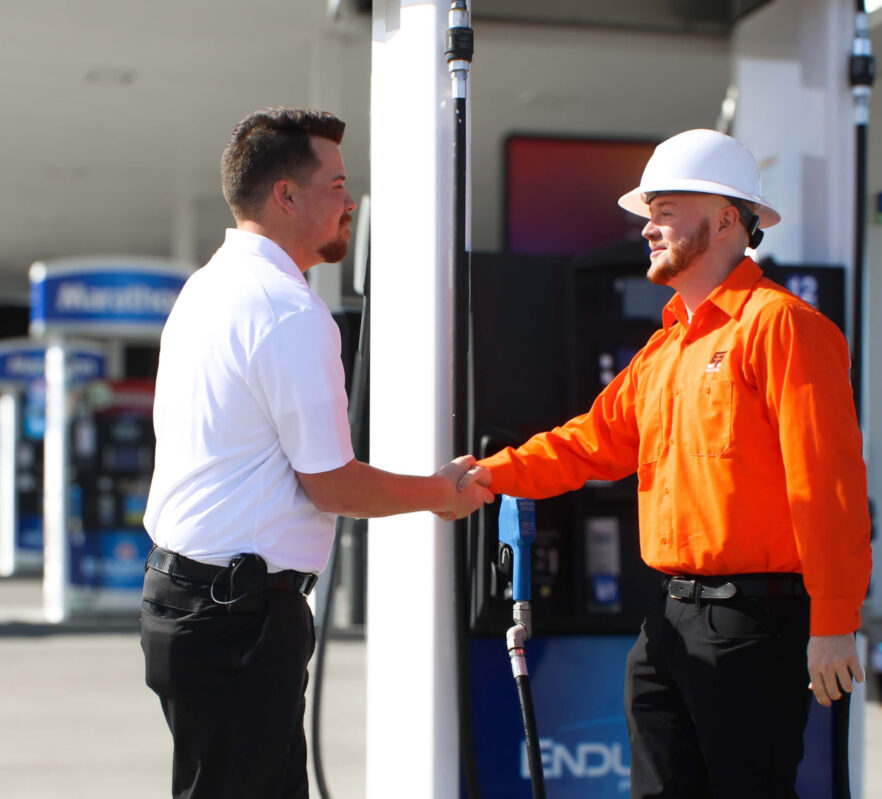 Two EPS employees shake hands