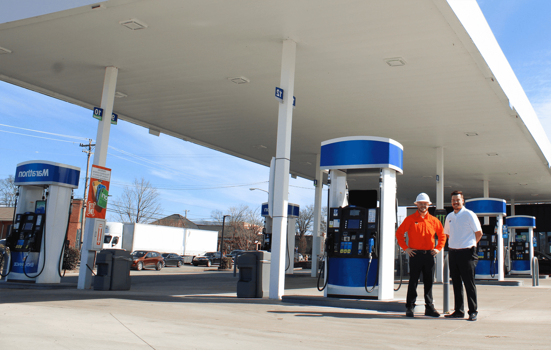 Employees pose at gas station project
