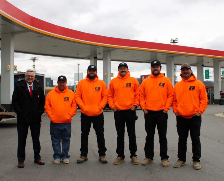 Image of EPS workers standing in front of store build