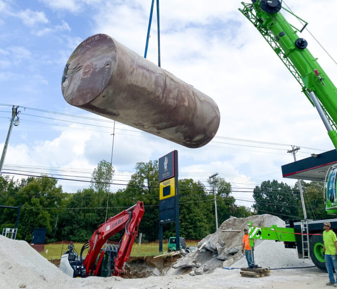 Tank is lifted by crane showcasing the tank removal services offered by EPS