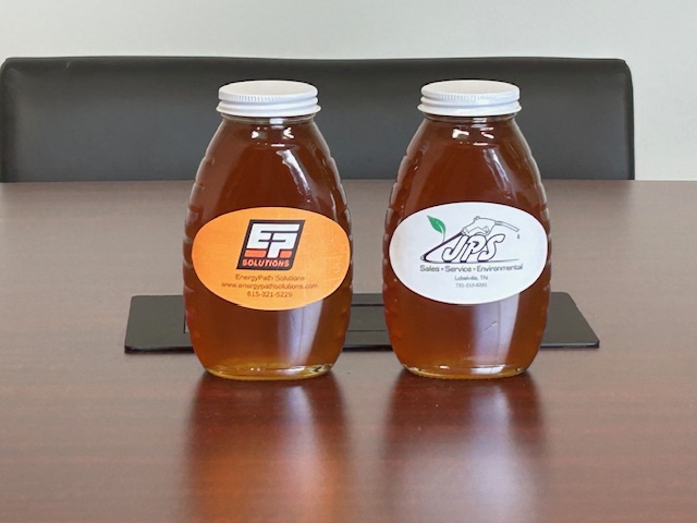Image of honey made by one of EPS very own employees with EPS logo on label
